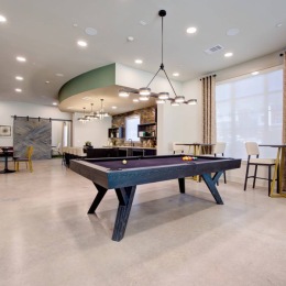 Shoot for better days at Sendero Trace and sink it every time when you unlock spaces like this. a room with a pool table, chairs and tables