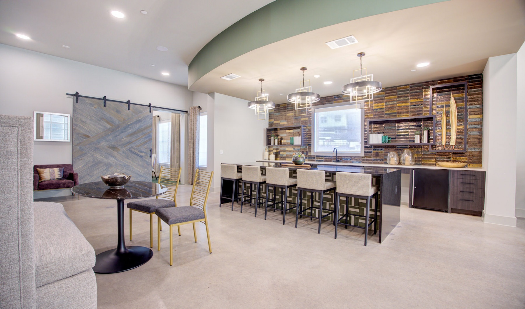 resident lounge with kitchen at Sendero Trace in San Marcos, TX
