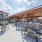 shaded grilling area next to eating tables and chairs